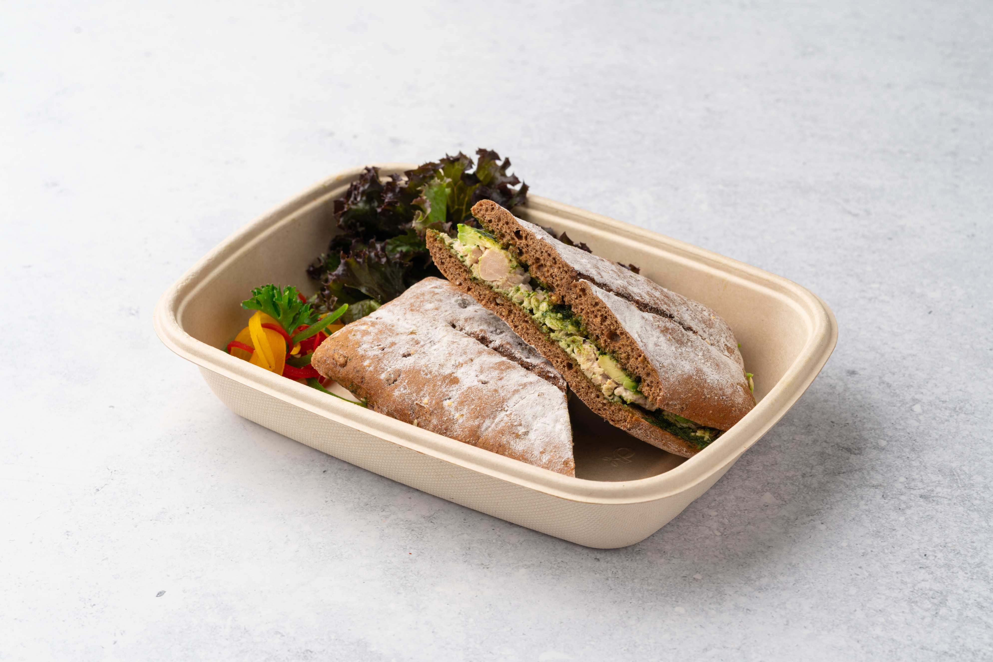 Spicy Tuna Cado Sandwich With Pesto Sauce And Avocado In Flat Bread